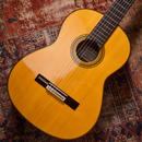Acoustic guitar on a patterned rug